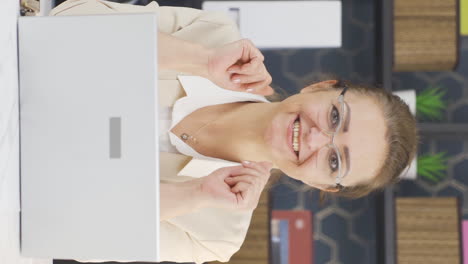 Vertical-video-of-Cheerful-and-caring-business-woman-looking-at-camera.